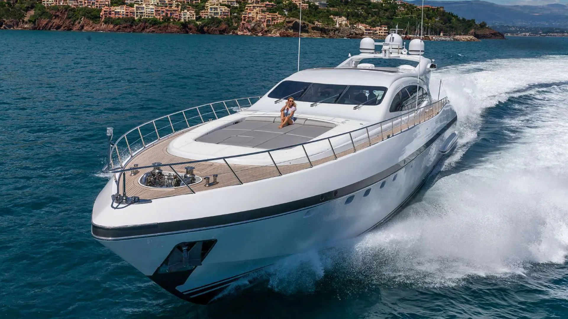 A premium motor yacht at speed off the Costa Smeralda